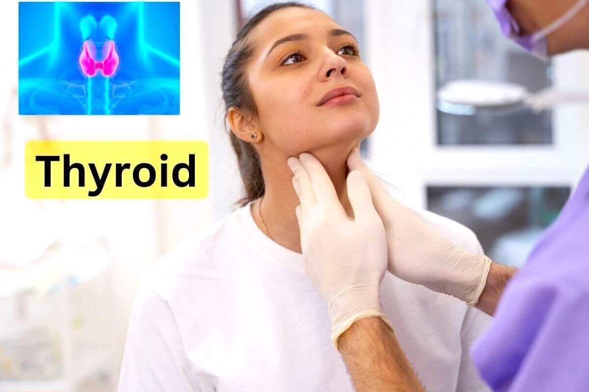 doctor examining thyroid in woman